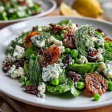 Bright lemon vinaigrette spring salad with radishes and peas, showcasing crisp greens, vibrant radishes, and sweet peas in a zesty lemon dressing.