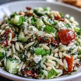 Crumbled feta and cucumber shine in this bright orzo salad, perfect for lunch.