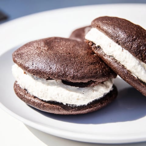 Warm, chocolatey Whoopie Pies, a classic dessert with creamy vanilla filling, ready to eat.