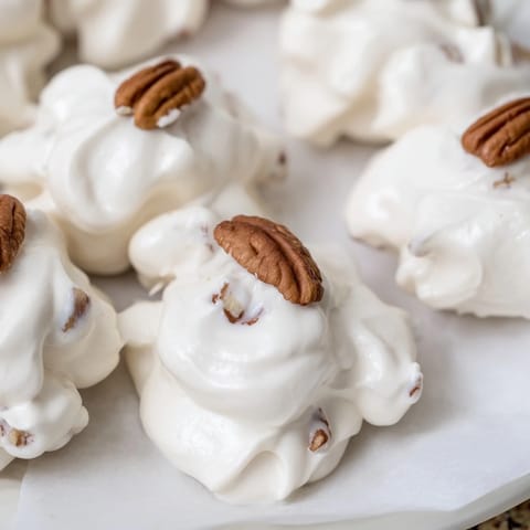 Homemade Divinity candy, a creamy, sweet treat studded with chopped pecans, ready to enjoy.
