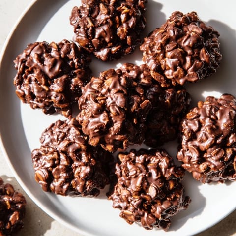 Warm, freshly made no-bake chocolate oatmeal drop cookies with promise of sweet flavor and quick preparation.