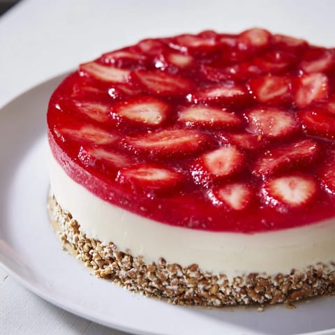 This image shows a beautiful slice of Strawberry Pretzel Salad, perfect for summer gatherings.