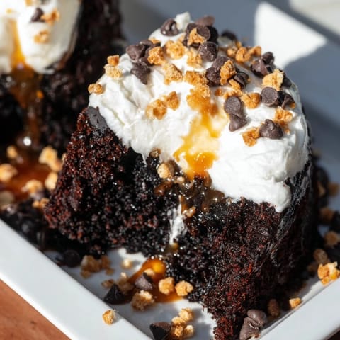 Irresistible Better Than Sex Cake, a chocolate poke cake, soaked and topped with delicious toffee.