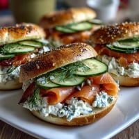 Golden cottage cheese bagels topped with silky smoked salmon, creamy cheese, and fresh dill.